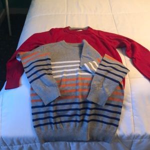 2 boys children place sweaters